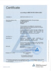 A pale blue certificate page has a thin printed border and a centered heading near the top. Several short field labels and longer text lines occupy the upper and middle sections, with a blue triangular mark at the lower right. A narrow footer line and small marks appear along the bottom.