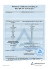 A pale blue document page shows a bold centered heading above a ruled table. The table fills most of the upper and middle area, with small text arranged in multiple columns and a blue triangular mark at the lower right. A narrow footer line and small marks sit along the bottom edge.